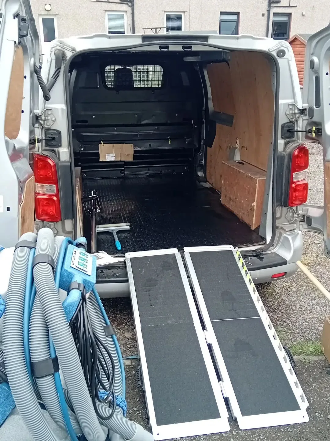 Rear of Dave's work van with equipment loading ramps